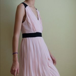 Pleated light pink dress.